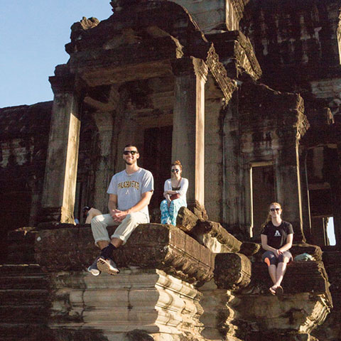 students visiting ruins in Asia