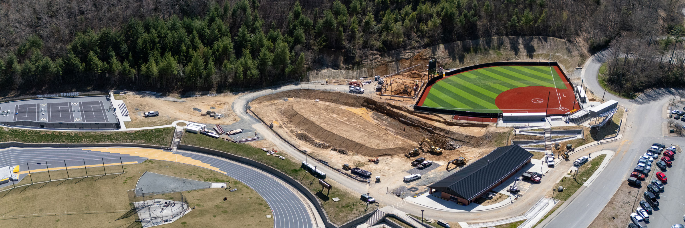 Panoramic view of Appalachian 105 site with tennis and softball work, April 9, 2025.
